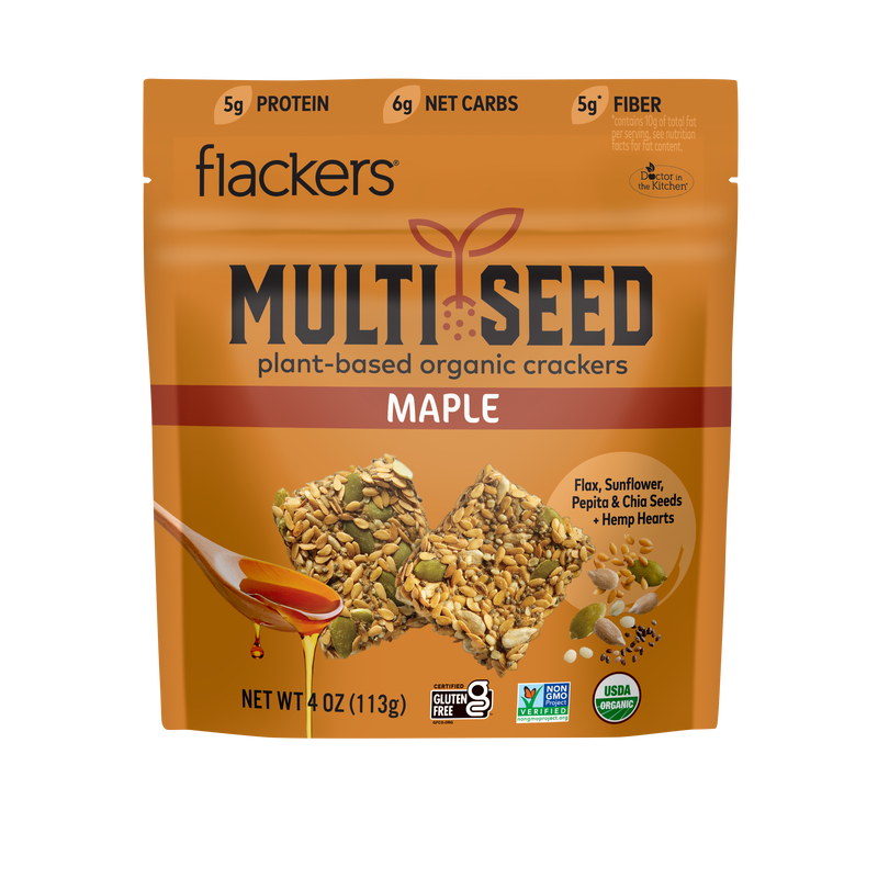 An orange bag depicting the Maple multi-seed cracker plant-based organic crackers with flax, sunflower, pepita, and chia seeds, plus hemp hearts
